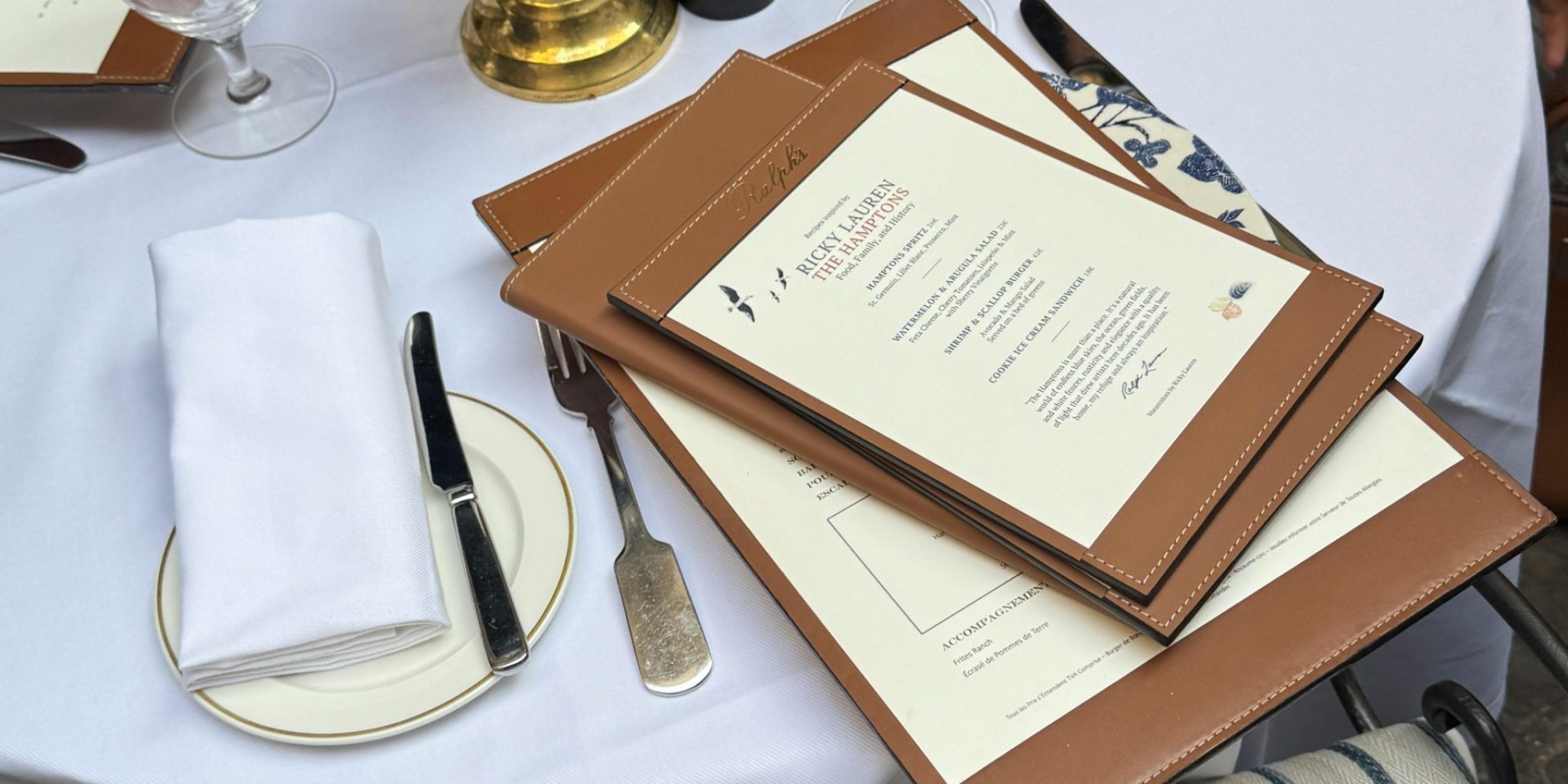 Classy dining table with menus and elegant decor in a restaurant setting.
